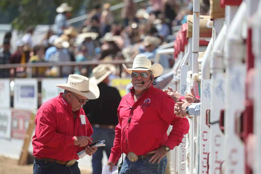 Ron Dunbar and Vince Genco in the arena at the Clovis Rodeo